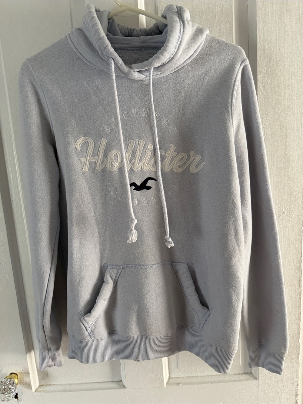 Hollister Light Blue Pullover Hoodie with Embroidered Logo and Drawstring